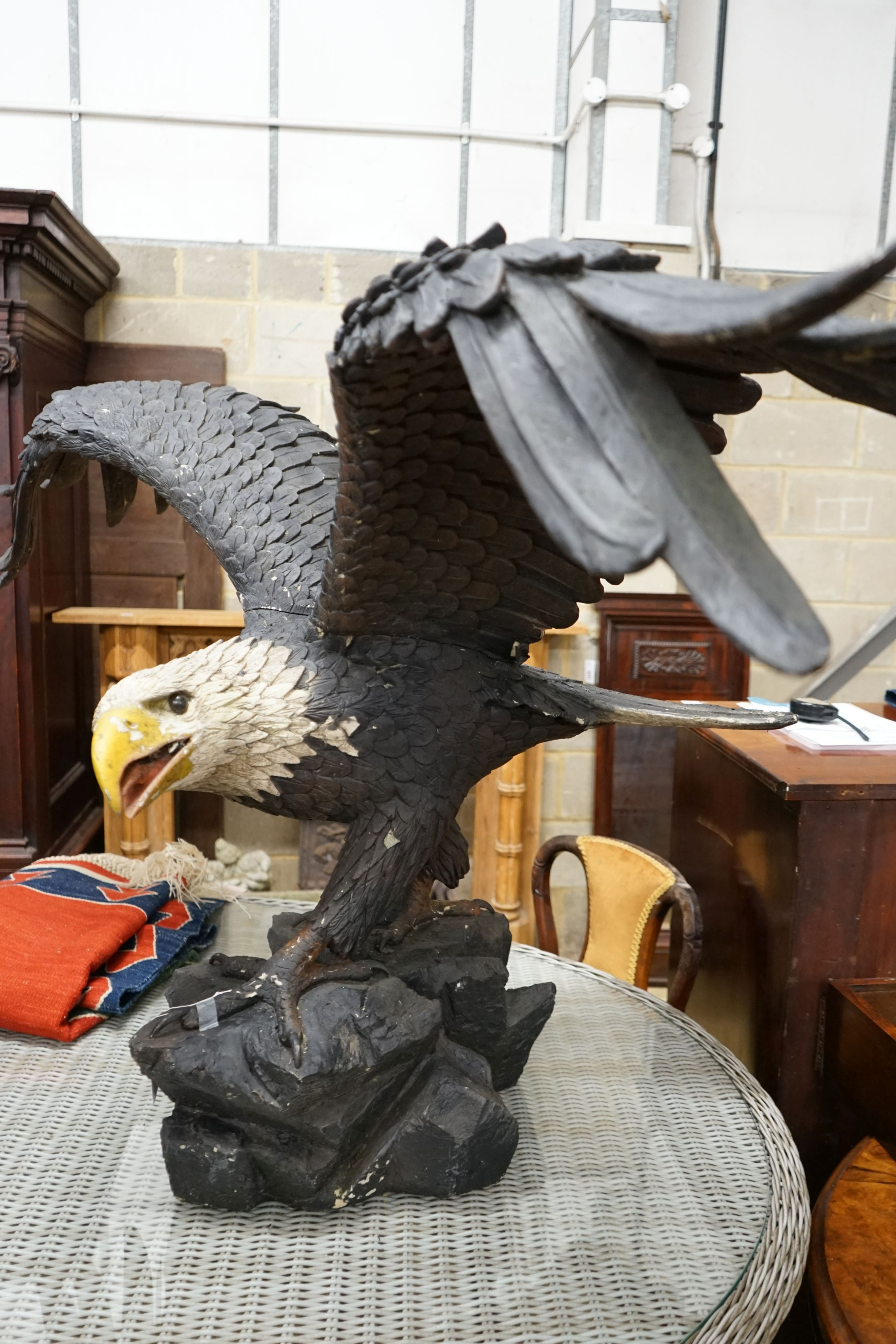A large composition Golden Eagle garden ornament, height 90cm, width 165cm